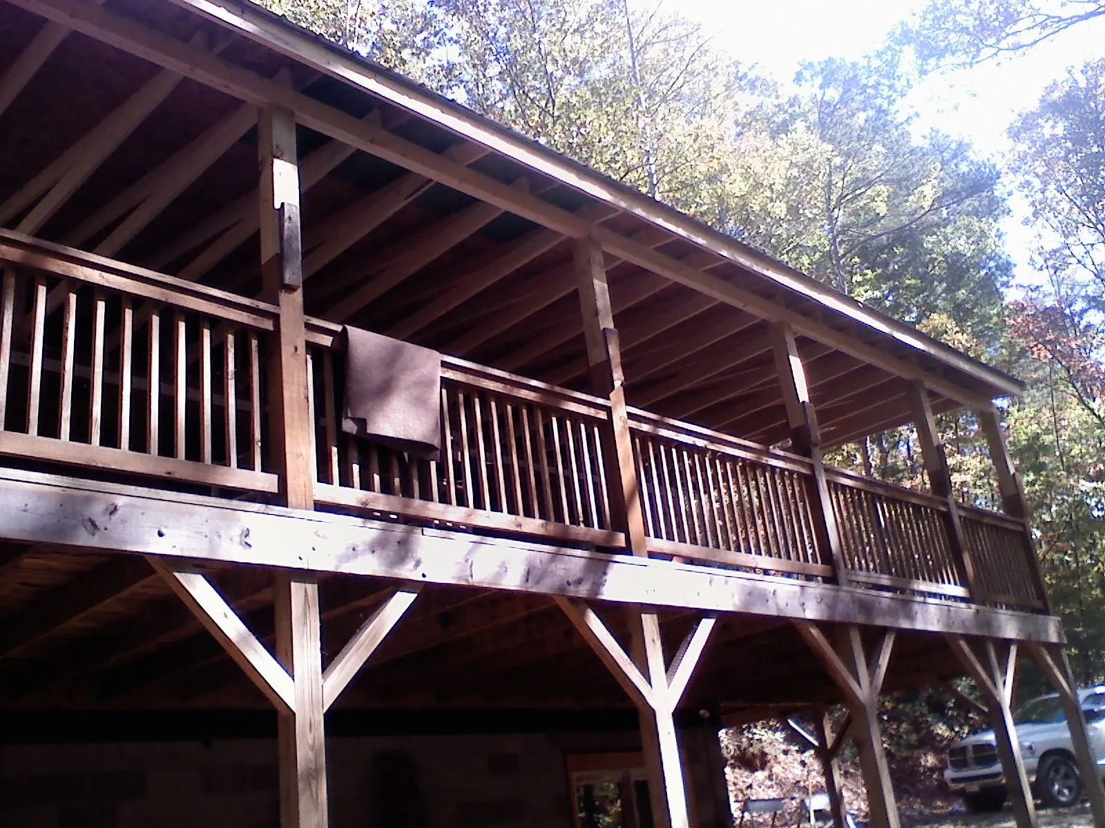 Timber framing under a new elevated porch and deck — Roof Leak Repair in Rural Valley by Roofing Brothers